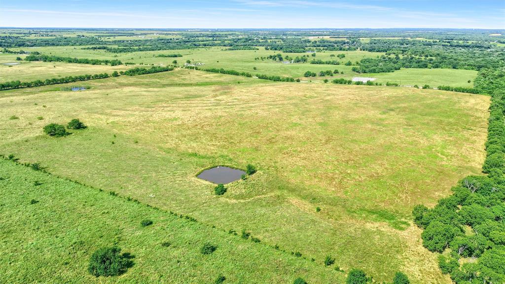 105 A Spalding Road Whitesboro, TX 76273 - Photo 20 of 30 a view of an outdoor space and a yard