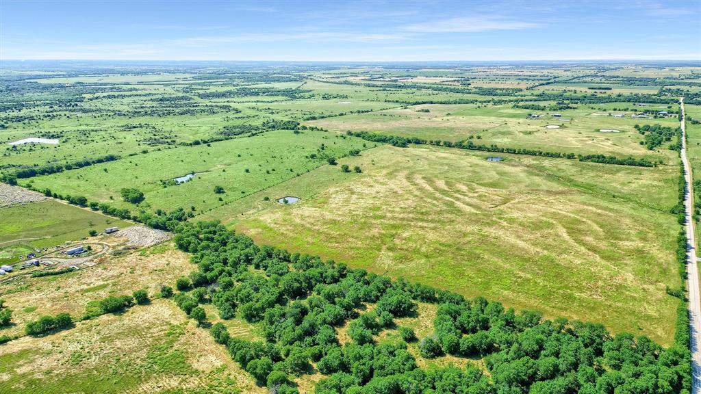 105 A Spalding Road Whitesboro, TX 76273 - Photo 21 of 30 a view of an ocean and a yard