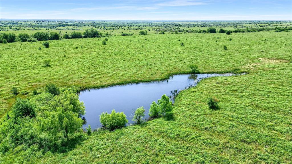 105 A Spalding Road Whitesboro, TX 76273 - Photo 22 of 30 a view of a garden with an outdoor space