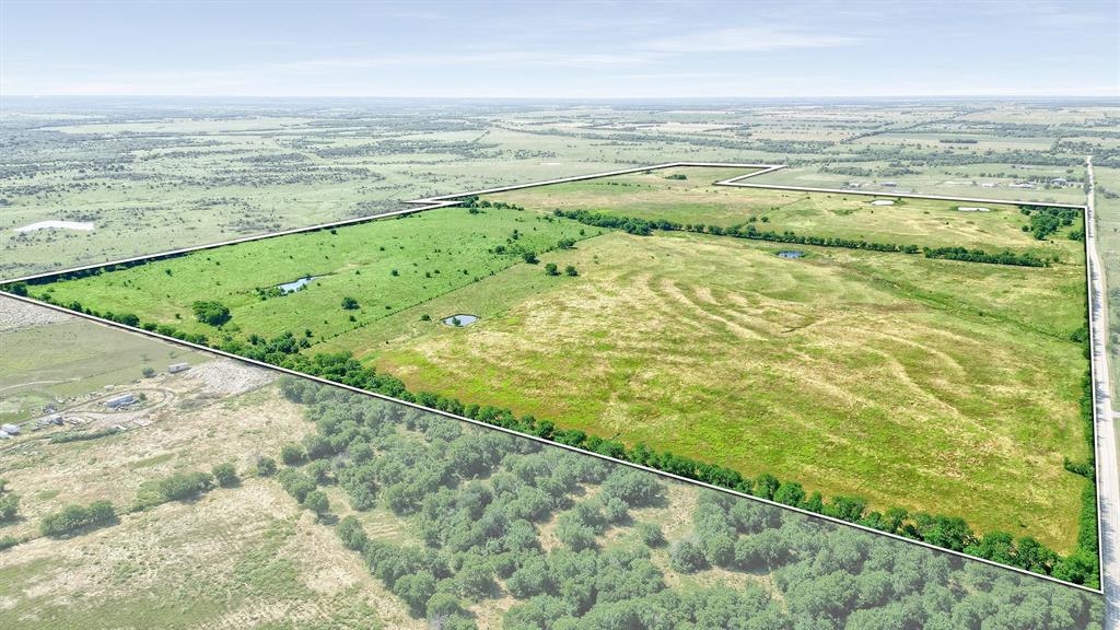 105 A Spalding Road Whitesboro, TX 76273 - Photo 27 of 30 a view of an ocean and a yard
