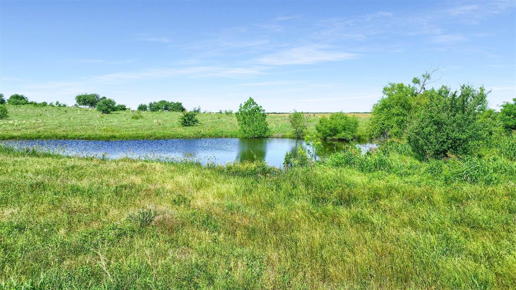 105 A Spalding Road Whitesboro, TX 76273 - Photo 3 of 30 a view of a lake with houses in the back