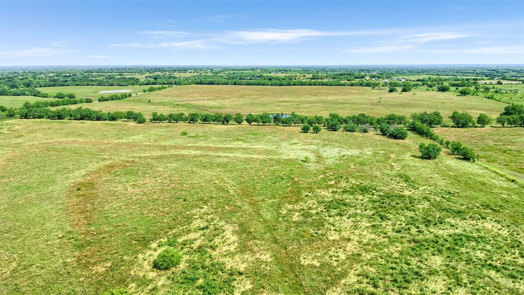 105 A Spalding Road Whitesboro, TX 76273 - Photo 5 of 30 a view of a green field with an ocean view