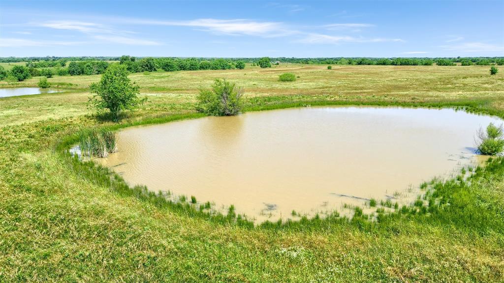 105 A Spalding Road Whitesboro, TX 76273 - Photo 9 of 30 a view of an ocean from a yard