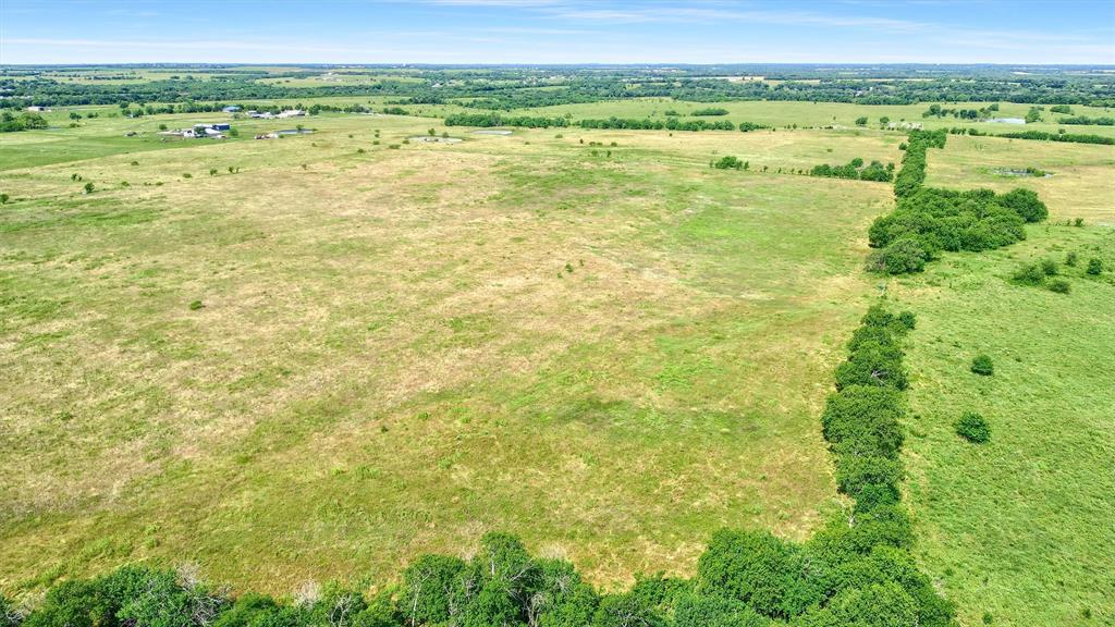 105 A Spalding Road Whitesboro, TX 76273 - Photo 10 of 30 a view of an outdoor space and a yard
