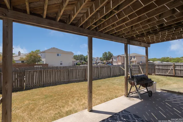 a view of a chairs and table in the patio