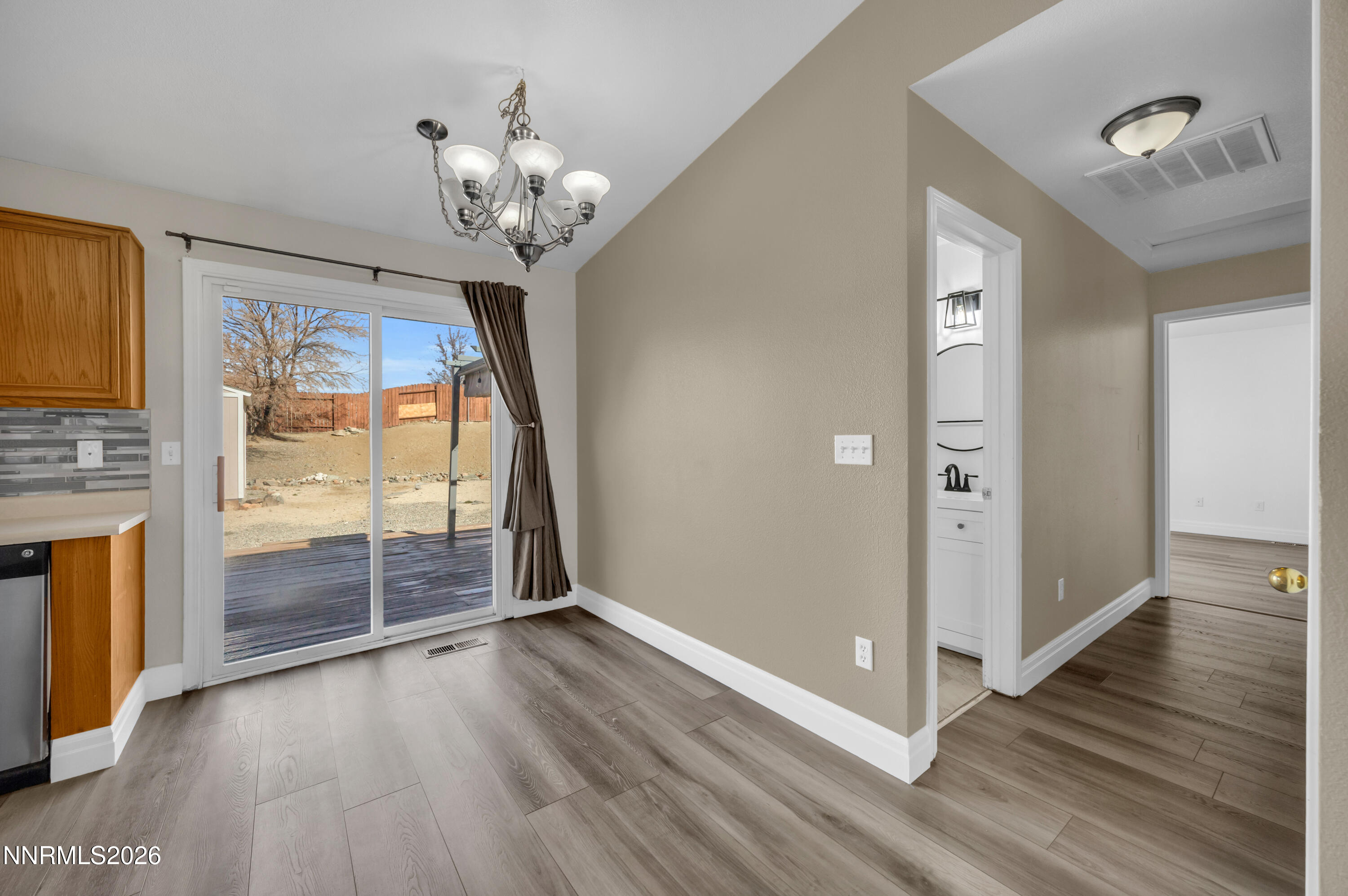 7295 Raphael Drive Sun Valley, NV 89433 - Photo 22 of 44 wooden floor in an empty room with a window