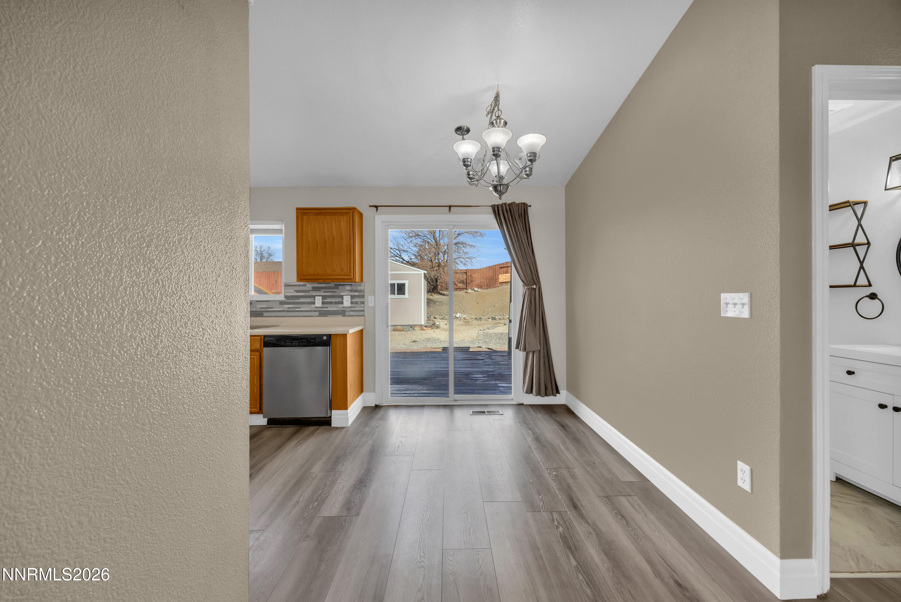 7295 Raphael Drive Sun Valley, NV 89433 - Photo 23 of 44 a view of a kitchen with a sink and wooden floor
