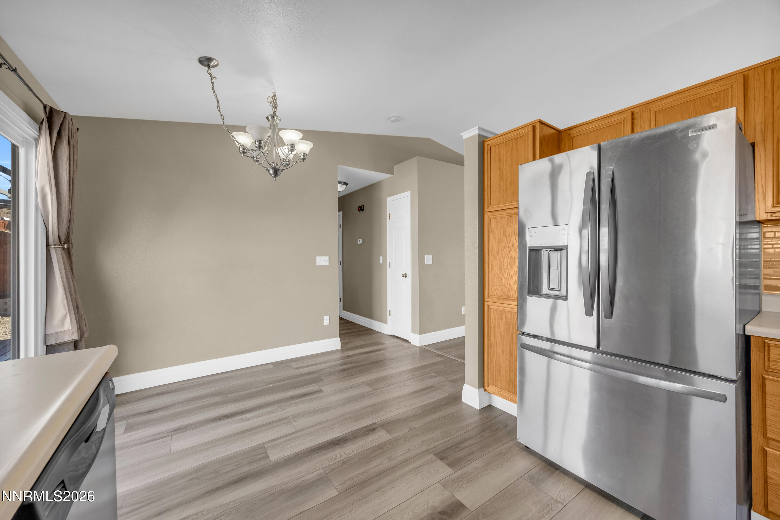 7295 Raphael Drive Sun Valley, NV 89433 - Photo 28 of 44 a kitchen with stainless steel appliances granite countertop a refrigerator a sink and a stove
