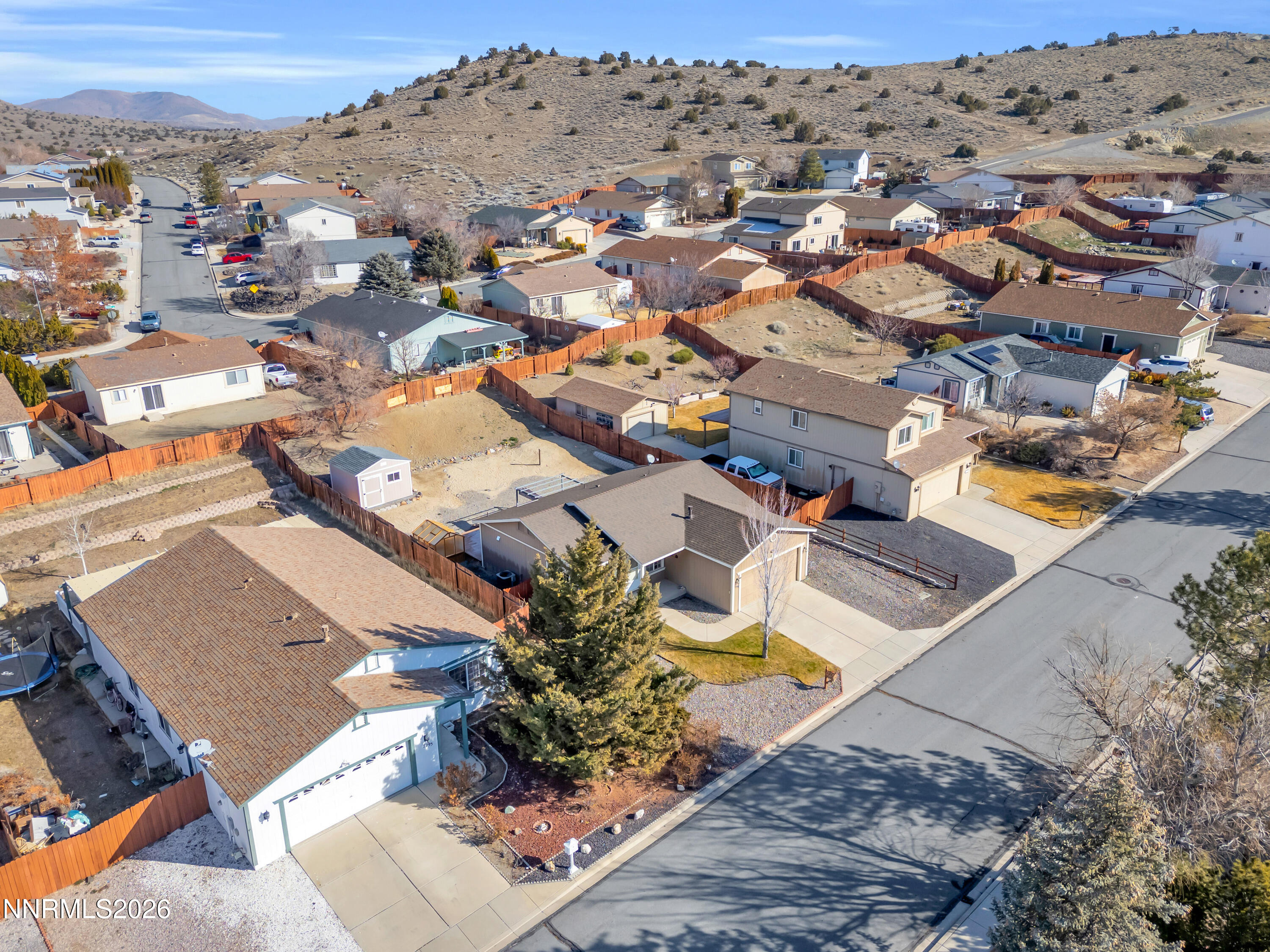 7295 Raphael Drive Sun Valley, NV 89433 - Photo 3 of 44 an aerial view of a house with a swimming pool