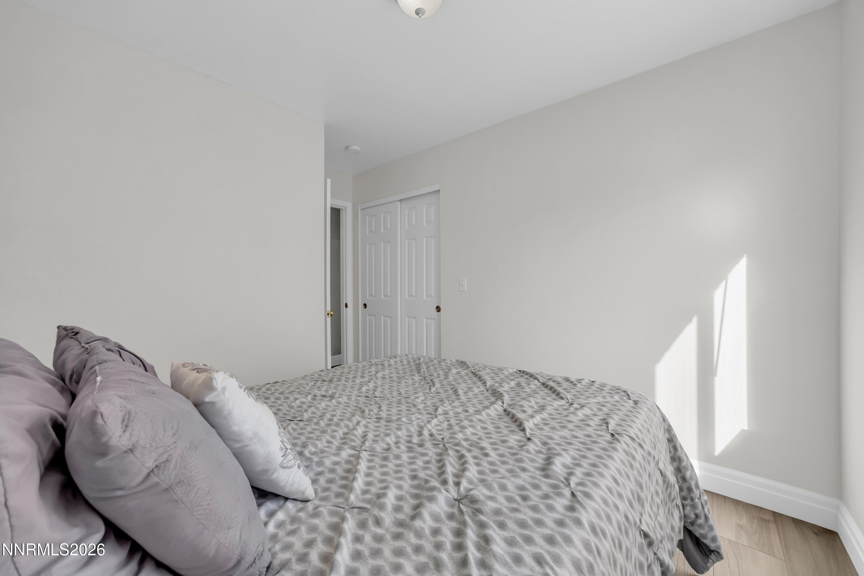 7295 Raphael Drive Sun Valley, NV 89433 - Photo 33 of 44 a bedroom with a bed and a window