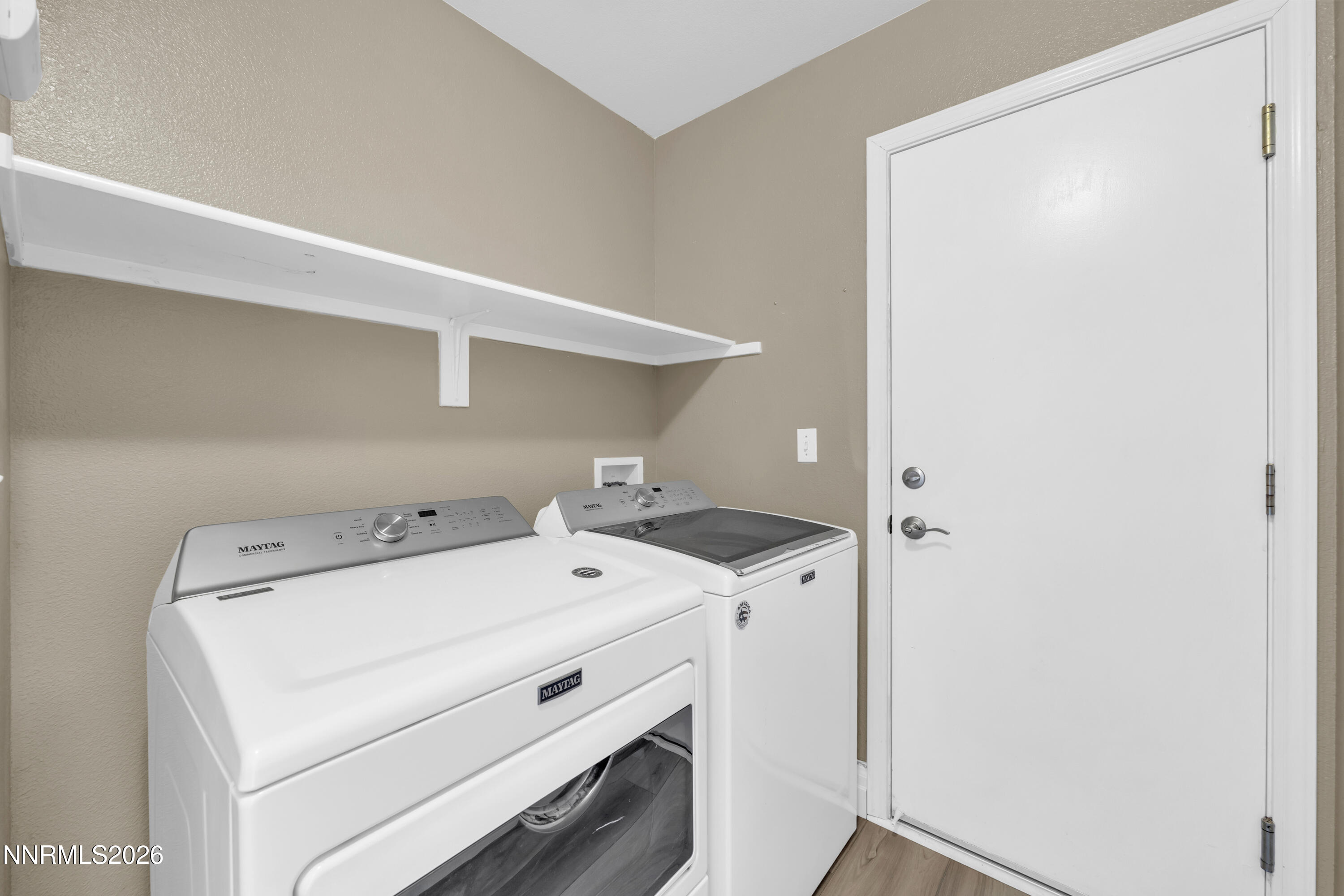 7295 Raphael Drive Sun Valley, NV 89433 - Photo 36 of 44 a utility room with dryer and washer