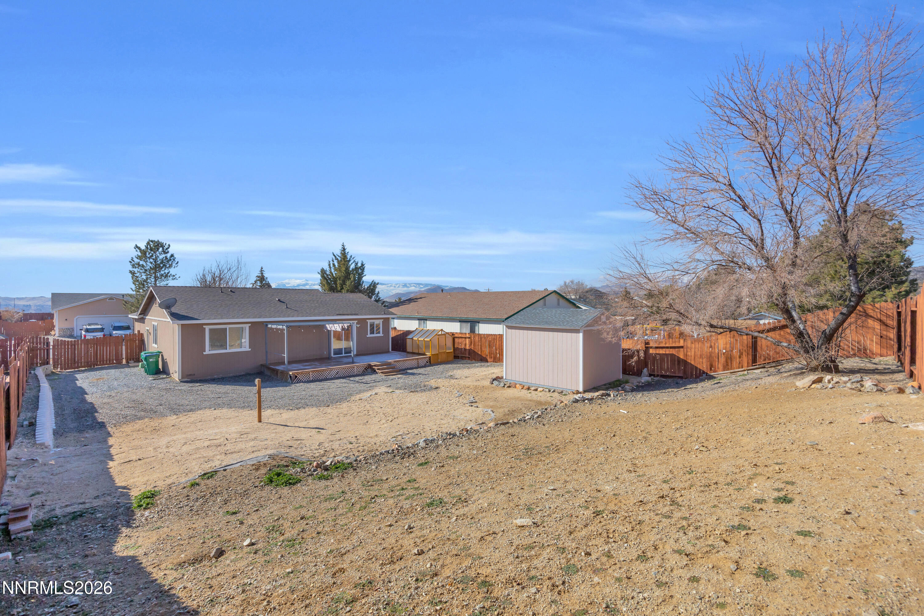 7295 Raphael Drive Sun Valley, NV 89433 - Photo 41 of 44 a view of a house with a yard covered in snow