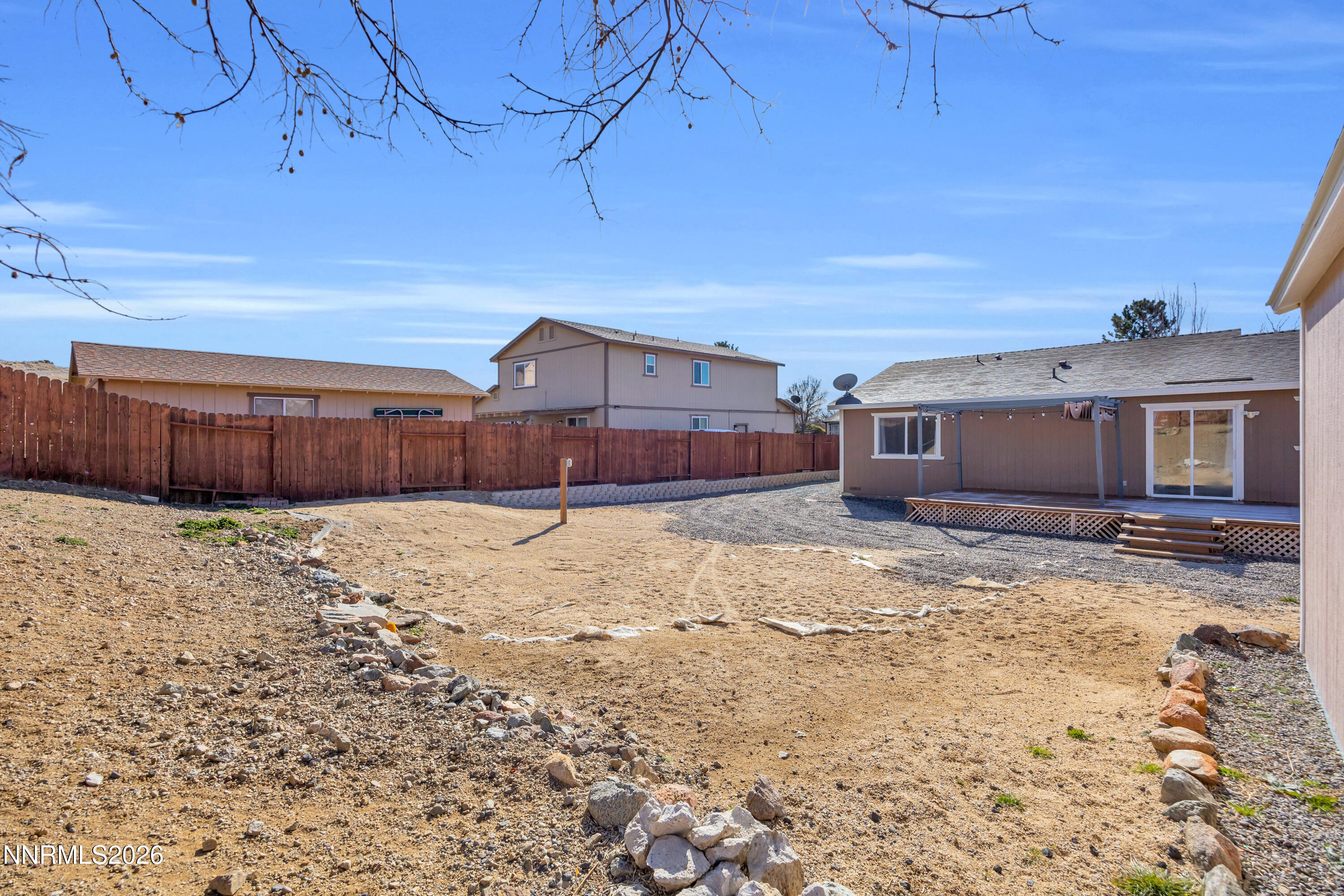 7295 Raphael Drive Sun Valley, NV 89433 - Photo 42 of 44 a front view of a house with a yard
