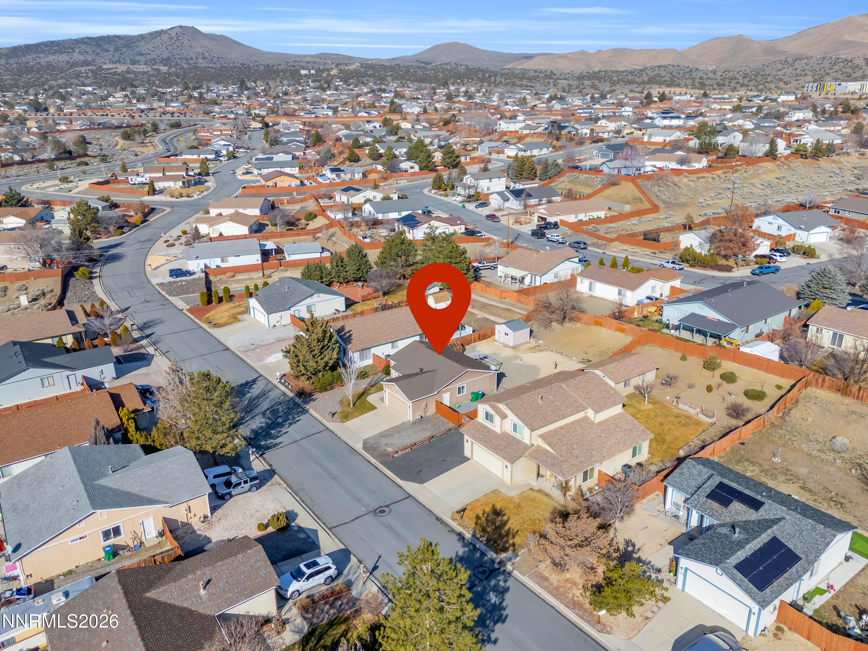 7295 Raphael Drive Sun Valley, NV 89433 - Photo 6 of 44 an aerial view of a city with lots of residential buildings