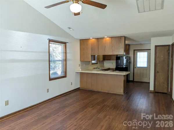 a view of kitchen with sink microwave and stove