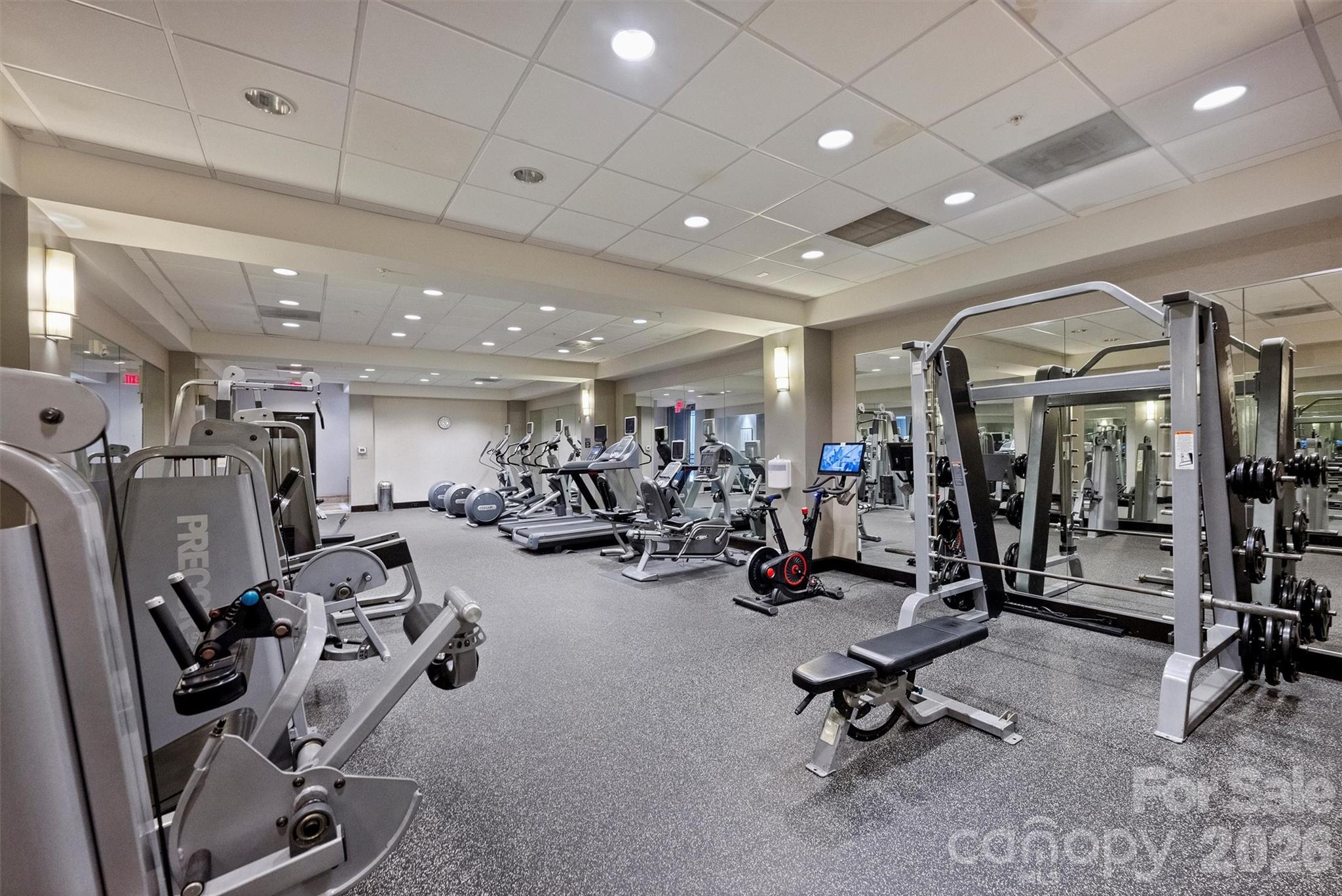 230 South Tryon Street, Unit 908 Charlotte, NC 28281 - Photo 27 of 31 a view of a room with gym equipment