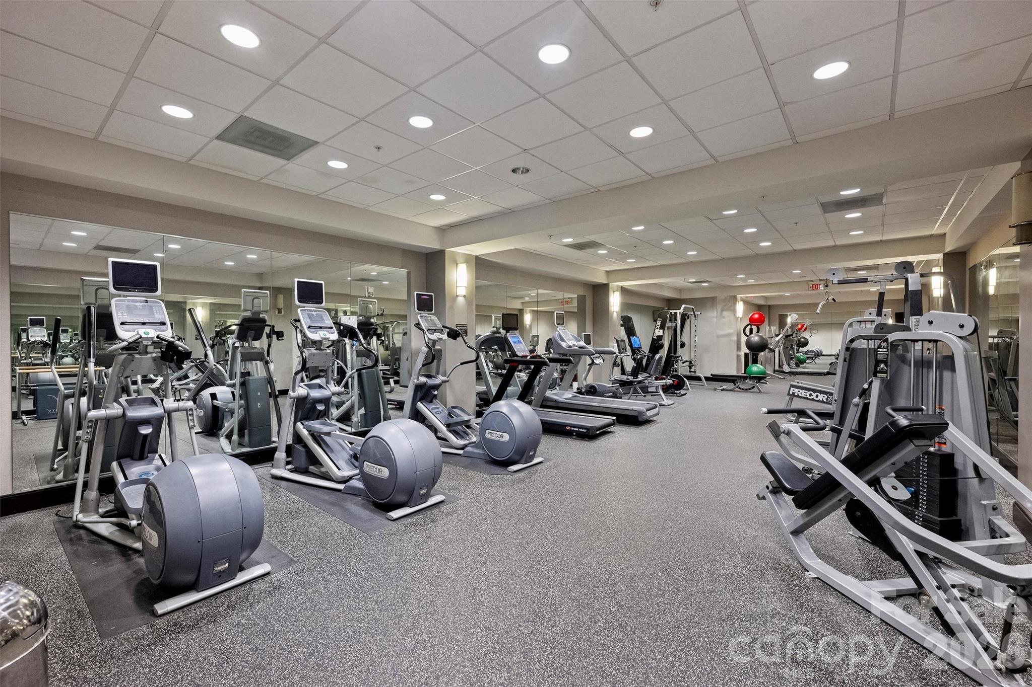230 South Tryon Street, Unit 908 Charlotte, NC 28281 - Photo 28 of 31 a view of a room with gym equipment