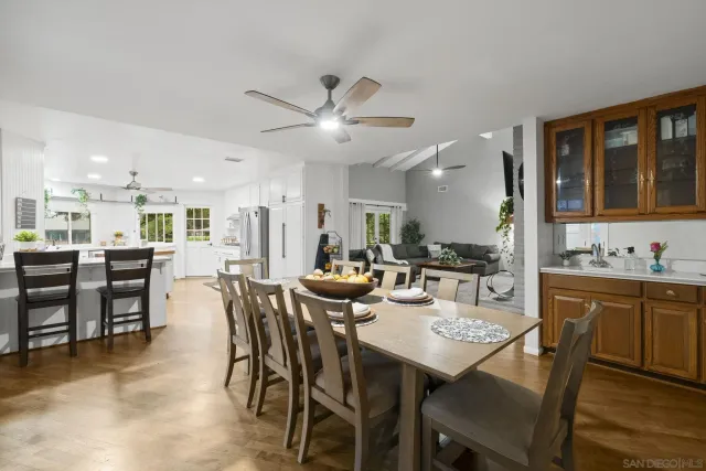 a view of a dining area with furniture and chandelier