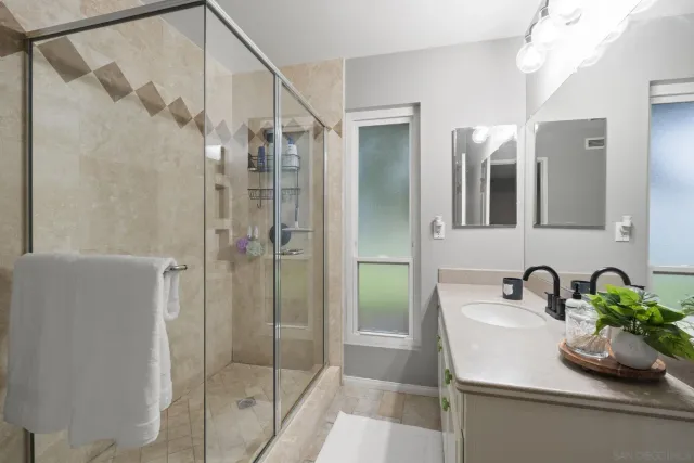 a bathroom with a sink and mirror