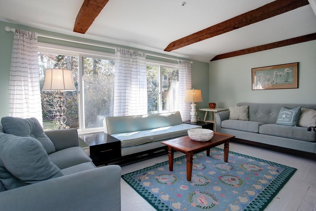 195 Crystal Lake Road Osterville, MA 02655 - Photo 11 of 36 a living room with furniture and a large window
