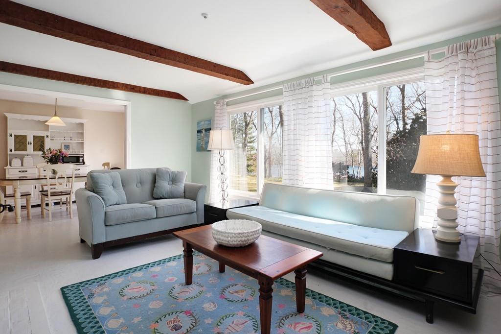 195 Crystal Lake Road Osterville, MA 02655 - Photo 12 of 36 a living room with furniture and a lamp