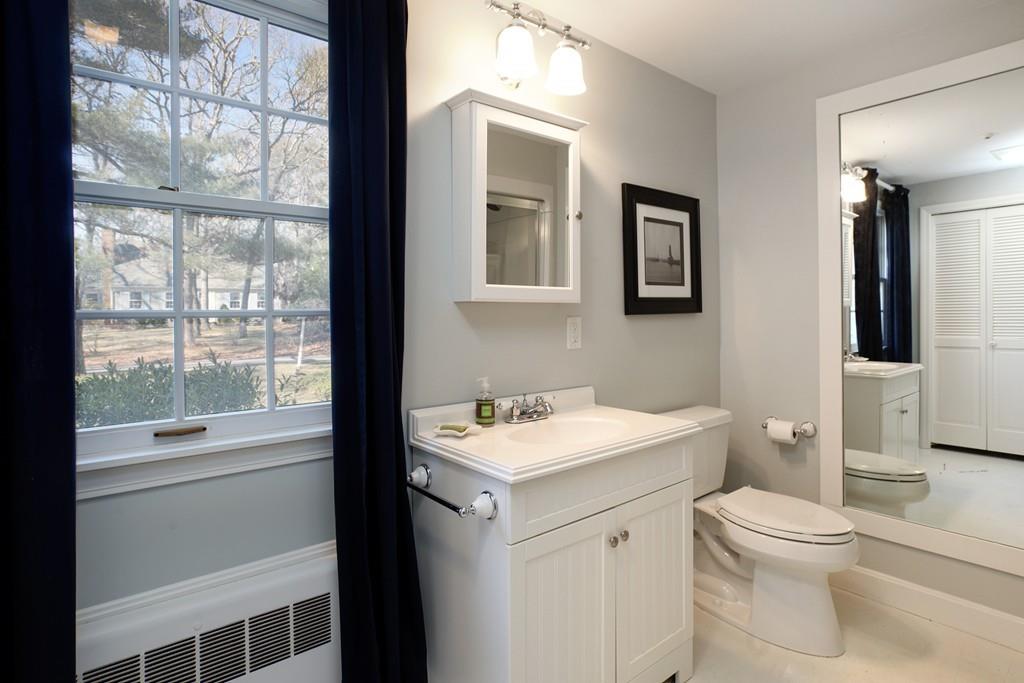195 Crystal Lake Road Osterville, MA 02655 - Photo 14 of 36 a bathroom with a sink toilet vanity and window