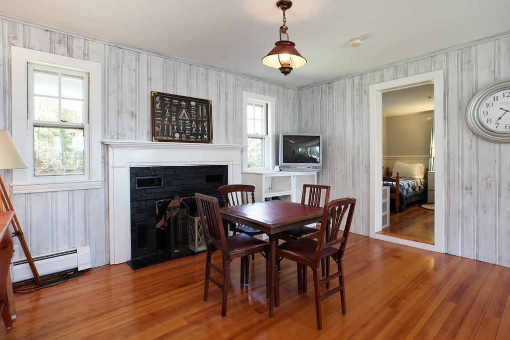 195 Crystal Lake Road Osterville, MA 02655 - Photo 16 of 36 a view of a dining room with furniture and wooden floor