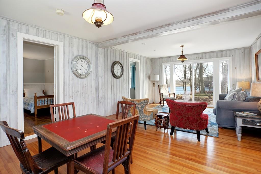 195 Crystal Lake Road Osterville, MA 02655 - Photo 17 of 36 a view of a dining room with furniture window and wooden floor