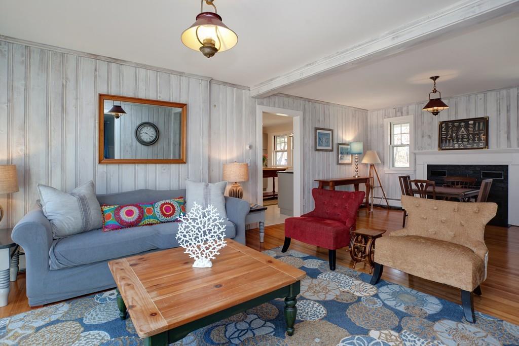 195 Crystal Lake Road Osterville, MA 02655 - Photo 18 of 36 a living room with furniture and a dining table