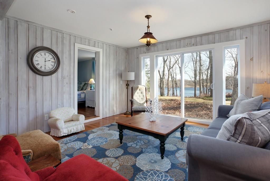 195 Crystal Lake Road Osterville, MA 02655 - Photo 19 of 36 a living room with furniture and a large window