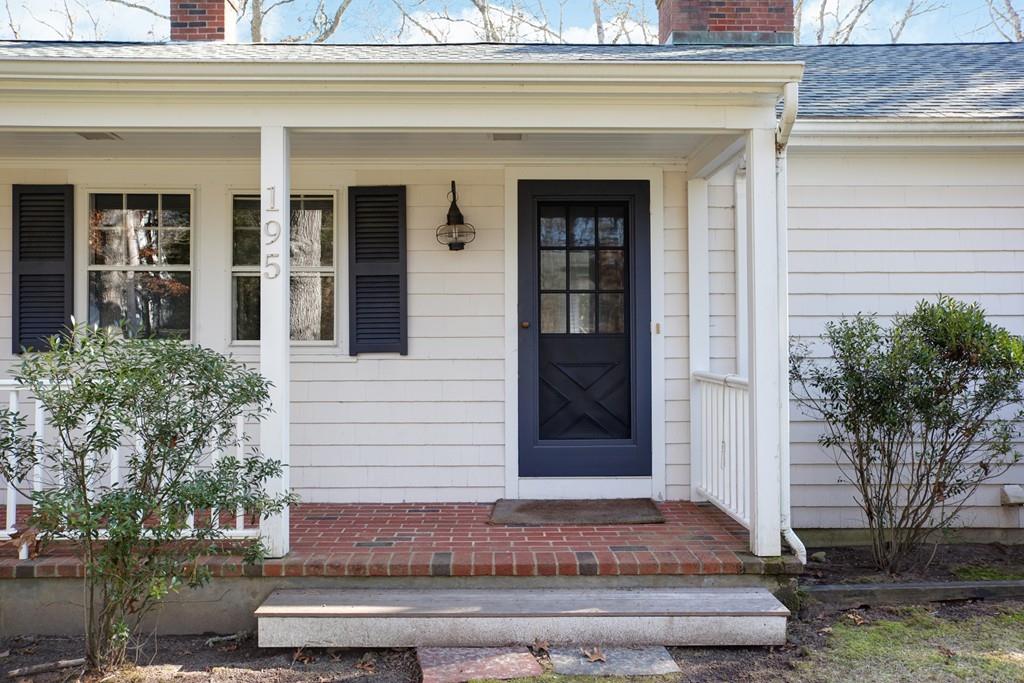 195 Crystal Lake Road Osterville, MA 02655 - Photo 2 of 36 a front view of a house with a yard