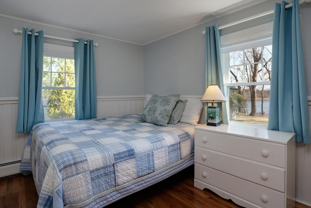 195 Crystal Lake Road Osterville, MA 02655 - Photo 21 of 36 a bedroom with a bed and a large window