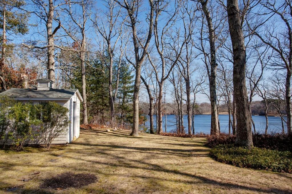 195 Crystal Lake Road Osterville, MA 02655 - Photo 25 of 36 a house with trees in front of it