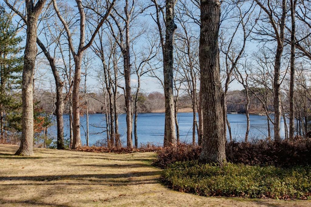 195 Crystal Lake Road Osterville, MA 02655 - Photo 26 of 36 a view of a white house with a large tree