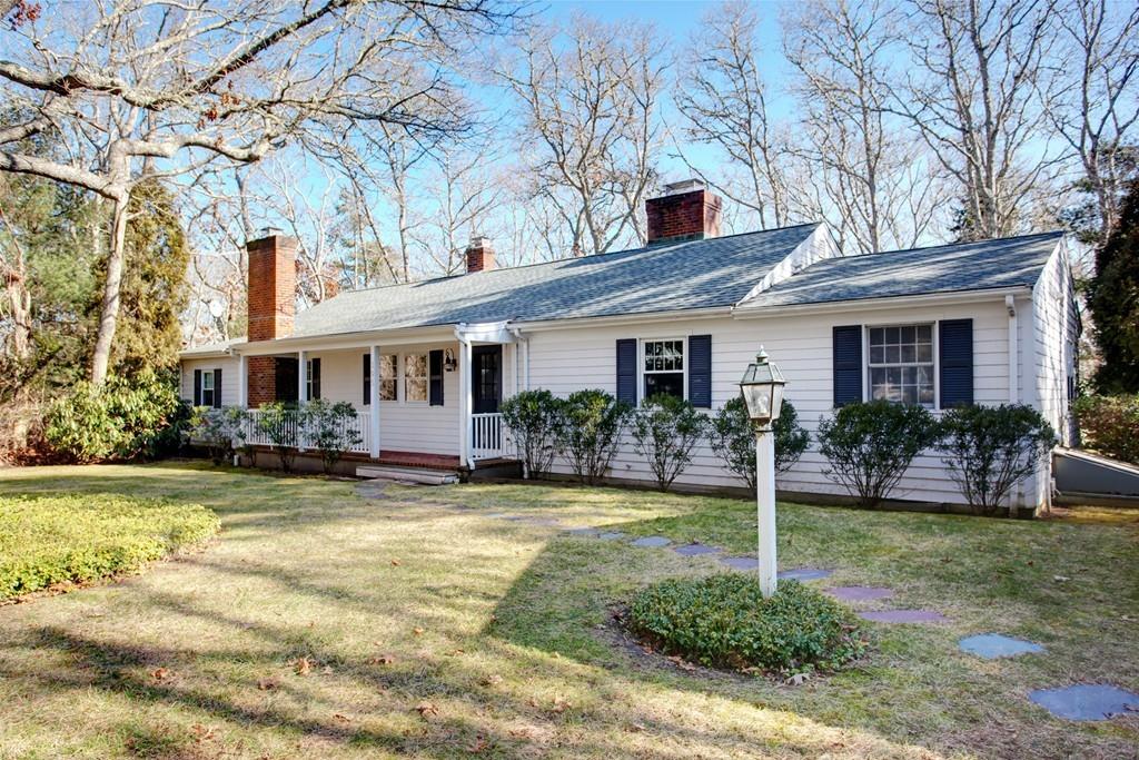 195 Crystal Lake Road Osterville, MA 02655 - Photo 32 of 36 a front view of a house with garden and porch