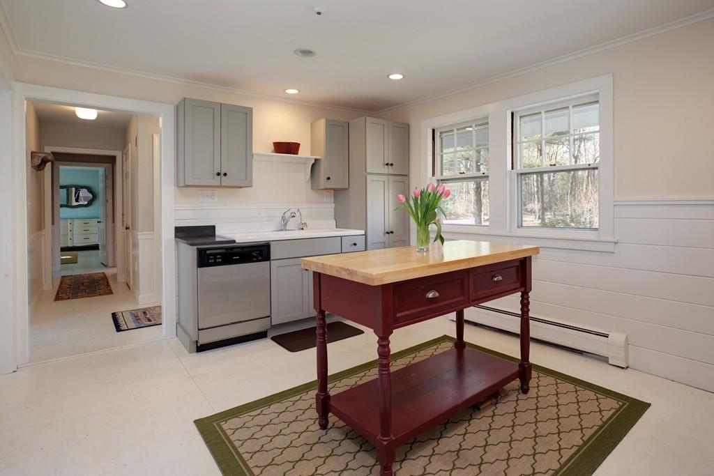 195 Crystal Lake Road Osterville, MA 02655 - Photo 5 of 36 a kitchen with a dining table chairs and window