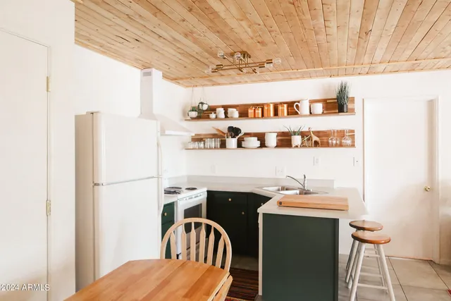 a hallway with a table and chairs