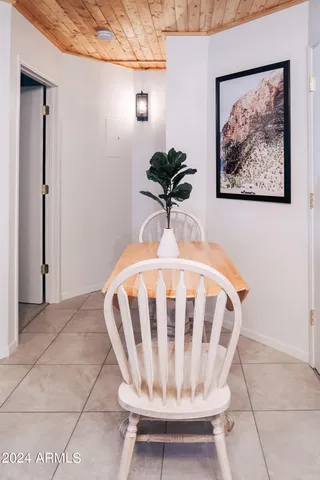 a view of entryway with a table and a chair