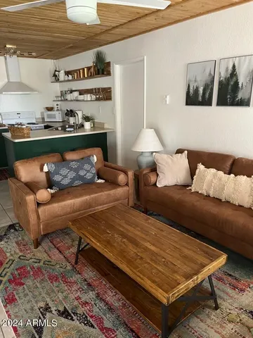 a living room with furniture and a lamp