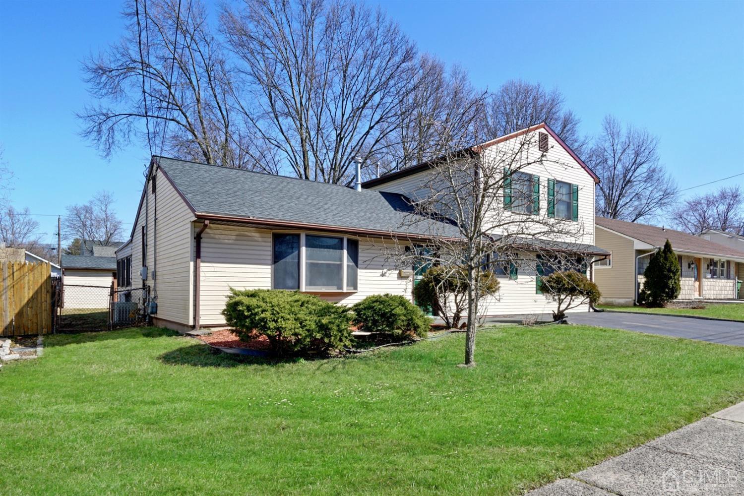 83 Winthrop Road Edison, NJ 08817 - Photo 3 of 36 a front view of a house with a garden and plants