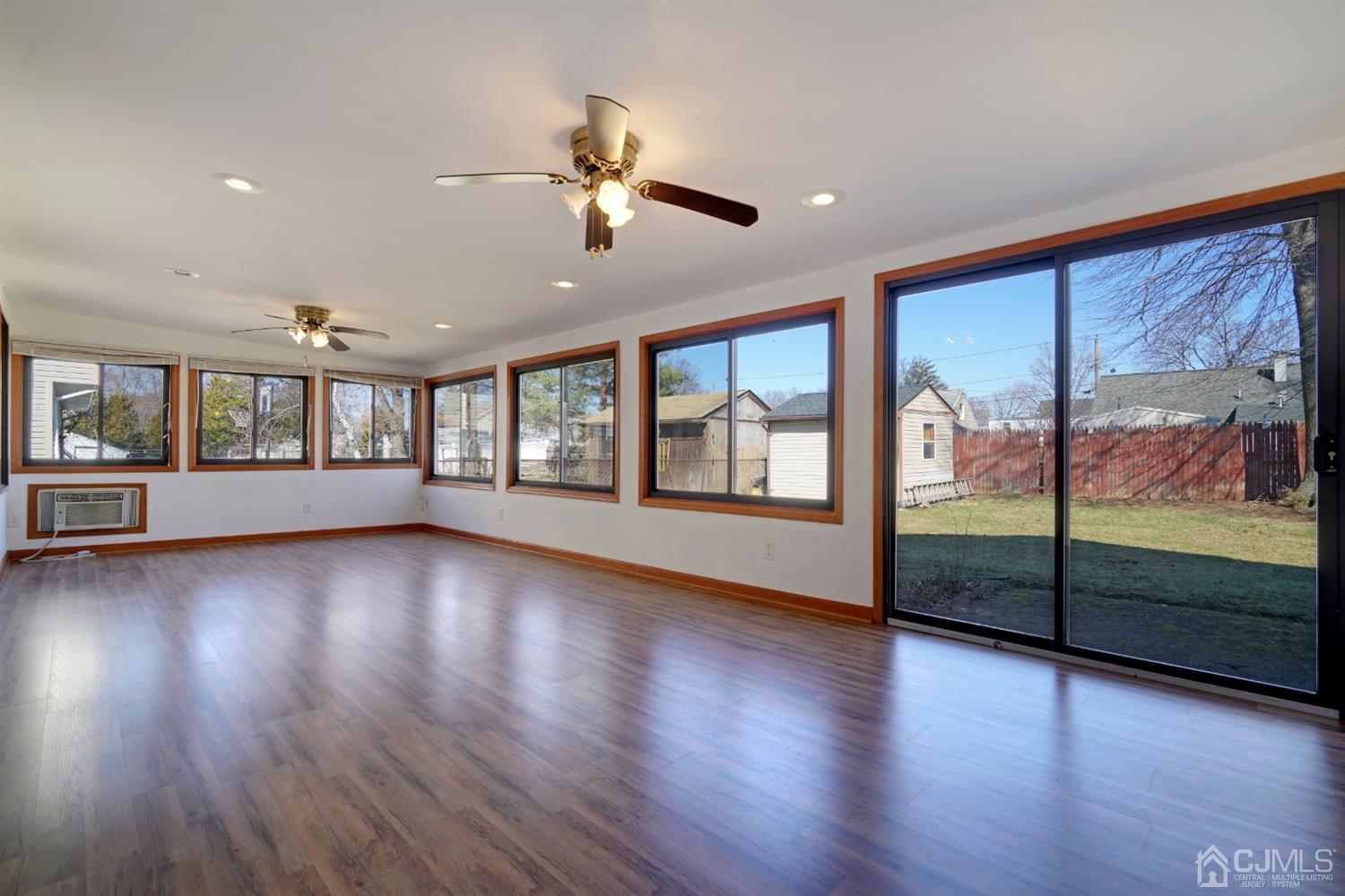 83 Winthrop Road Edison, NJ 08817 - Photo 22 of 36 a view of an empty room with wooden floor and a window