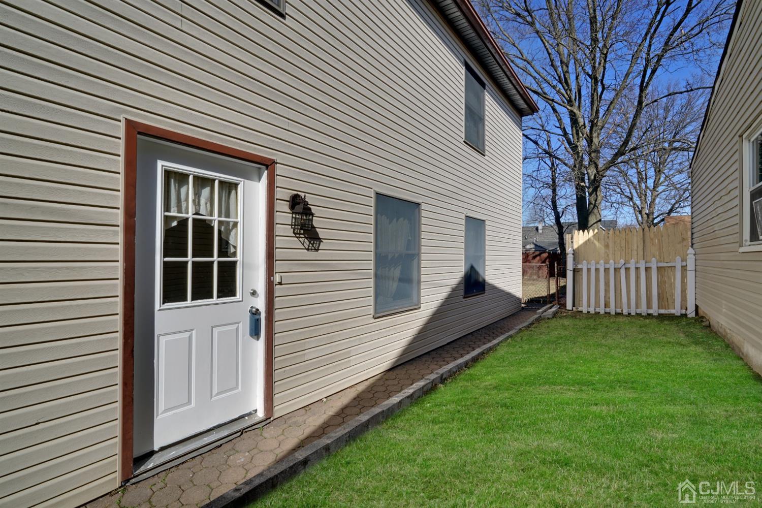 83 Winthrop Road Edison, NJ 08817 - Photo 36 of 36 front view of a house with a yard