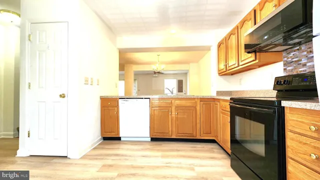 a kitchen with a sink and a stove