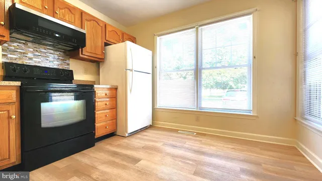a view of a kitchen with a sink and dishwasher