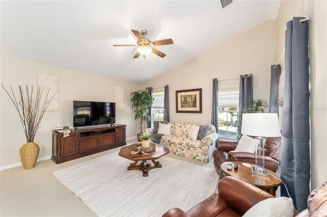 a living room with furniture and a table