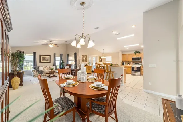 a kitchen with stainless steel appliances kitchen island granite countertop a sink and cabinets