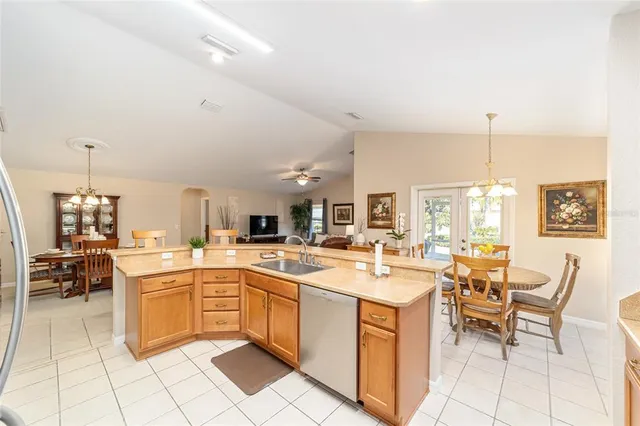 a kitchen with a sink stainless steel appliances and cabinets