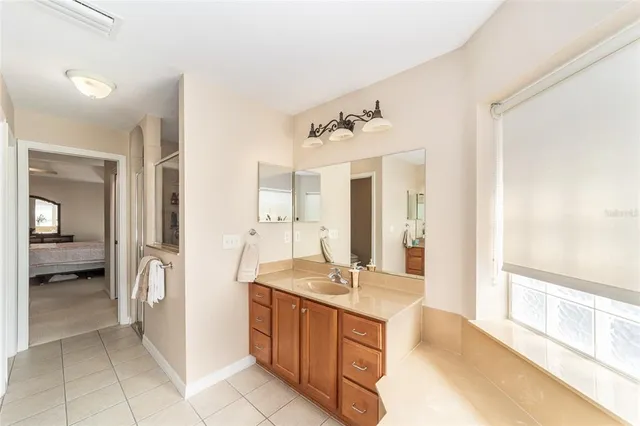 a bedroom with a bed and dresser