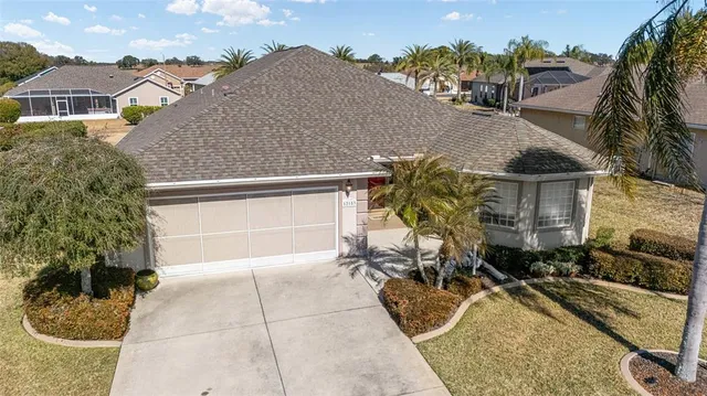 an aerial view of a house with outdoor space