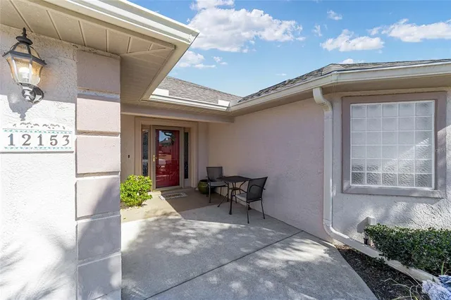a front view of a house with outdoor seating